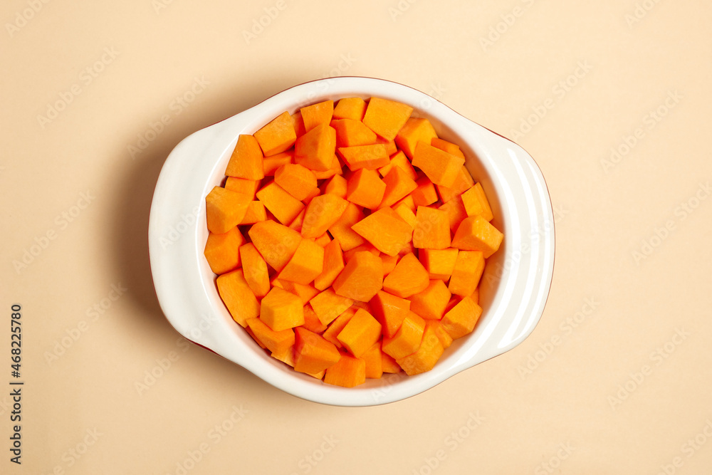 chopped pumpkin pieces in a saucepan top view. healthy food. Flat lay of utensils for cooking on beige background chopped pumpkin pieces in a saucepan top view. healthy food. Flat lay of utensils for cooking on beige background