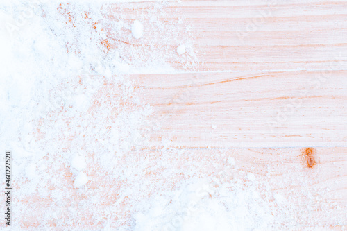 Winter wood. Christmas board with old rustic wall, white frozen snow . Winter wooden texture background. inimal flat lay. photo