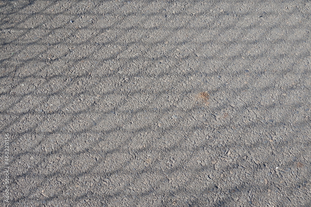 Blacktop with Diamond Shaped Shadow as Background Blacktop with Diamond Shaped Shadow as Background