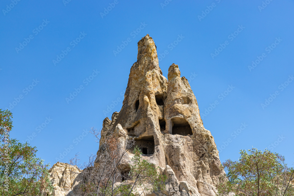 Unique geological formations in Goreme Open Air Museum at sunny day in Cappadocia, Central Anatolia, Turkey.