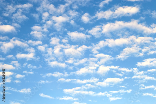 White stratus clouds on summer blue sky - simple blurred background