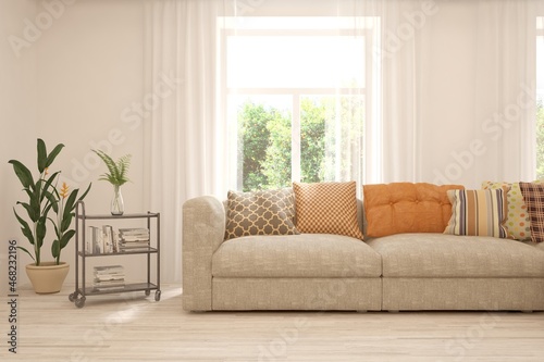 White living room with sofa and summer landscape in window. Scandinavian interior design. 3D illustration © AntonSh