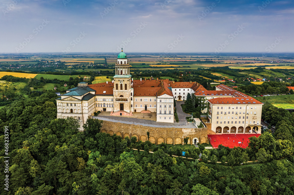 Pannonhalma, Hungary - Aerial view of the beautiful Millenary Benedictine Abbey of Pannonhalma (Pannonhalmi Apatsag) with clear bluet sky and green summer foliage at summertime