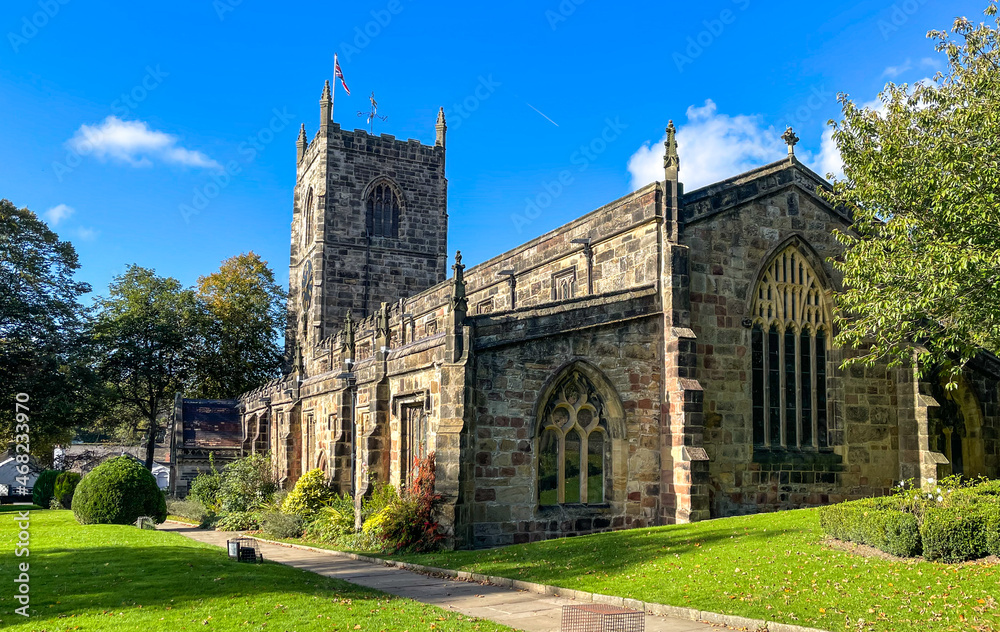 Fototapeta premium Church Holy Trinity stands at the top of the High Street, by the castle, in the beautiful market town of Skipton - the gateway to the Yorkshire Dales.