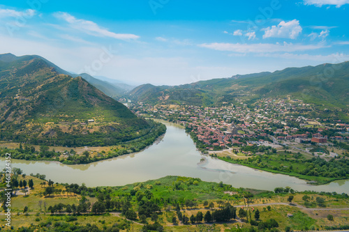 The top view of Mtskheta, Georgia. The historical town lies at the confluence of the rivers Mtkvari and Aragvi. Georgian landscape with blue sky above
