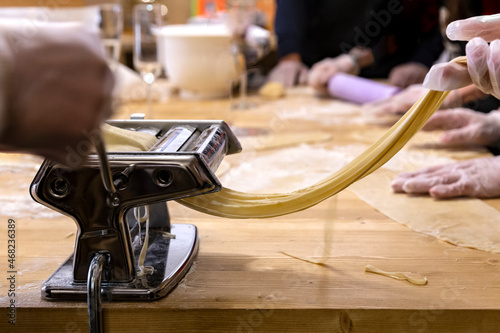 Cooking homemade Italian pasta spaghetti using a pasta maker machine