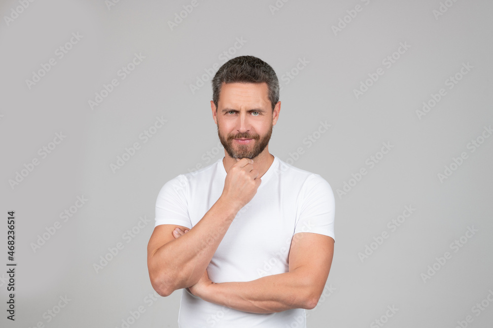 I am what I think. Thoughtful man grey background. Serious guy think stroking chin. Everyday thinking I am what I think. Thoughtful man grey background. Serious guy think stroking chin. Everyday thinking