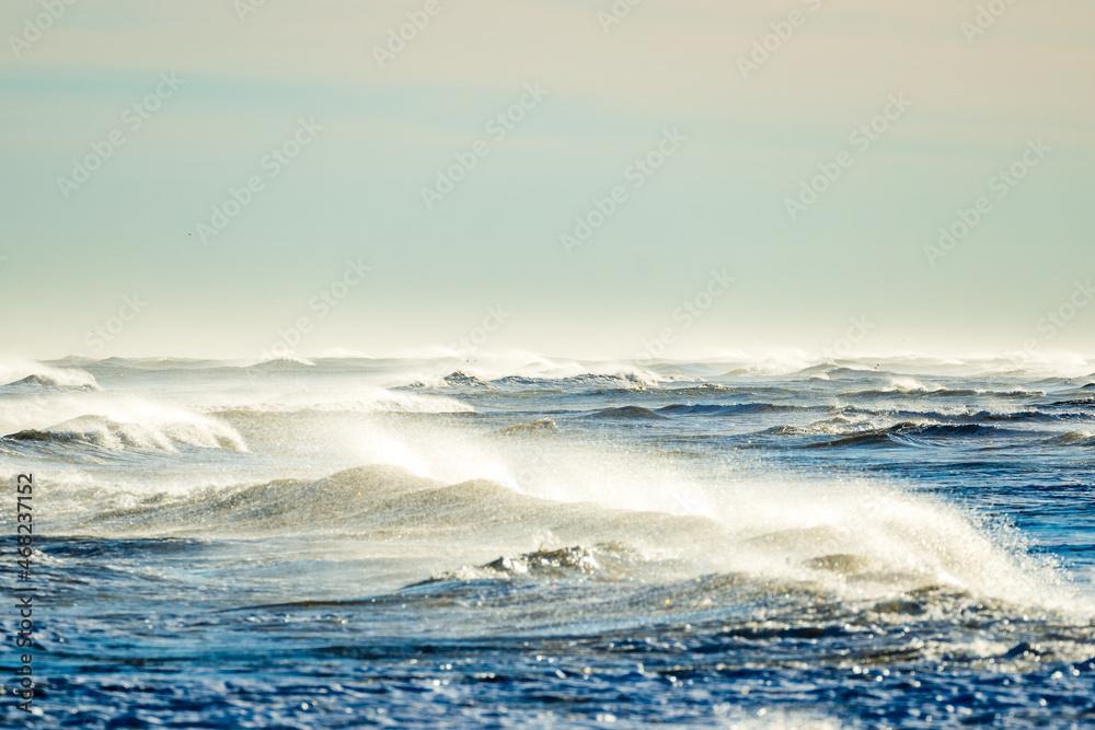Fototapeta premium Large waves on the beach of Ebro delta in Spain on a sunny day