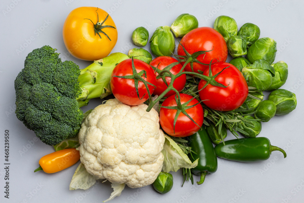 Cauliflower, broccoli and a branch of red tomatoes. Cauliflower, broccoli and a branch of red tomatoes.