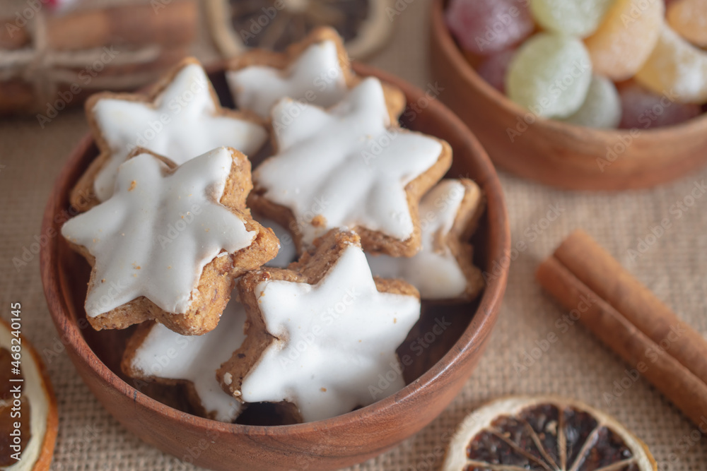 Christmas cookies in the shape of a star with white icing.