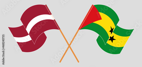 Crossed and waving flags of Latvia and Sao Tome and Principe