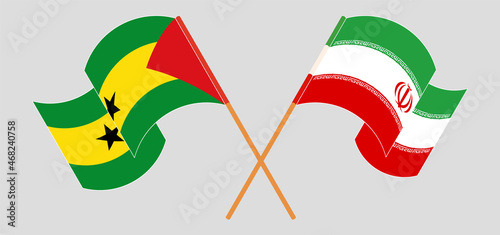 Crossed and waving flags of Sao Tome and Principe and Iran