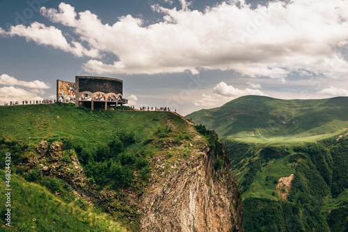 Beautiful view of the historical the Russiaâ€“Georgia Friendship Monument  on the green mountains photo