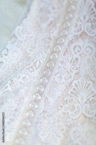 Macro view texture , pattern, fabric and details on white wedding dress