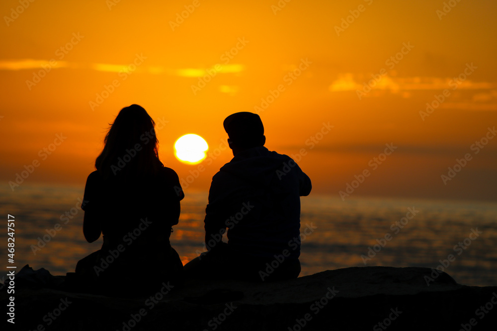 silhouette of a couple on a beach