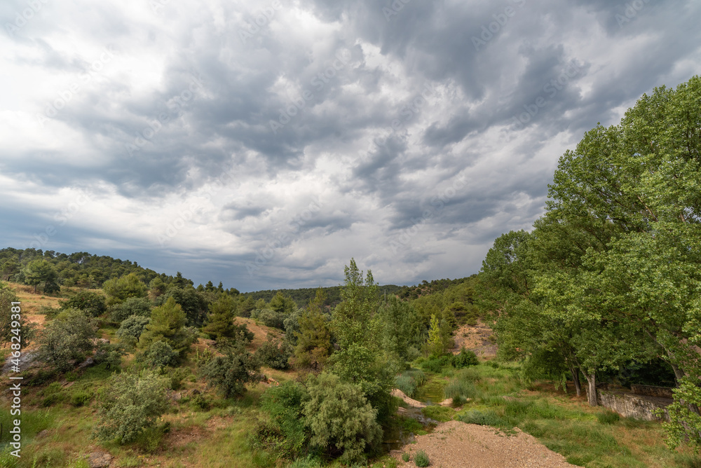 Landscape in the countryside with cloudy sky