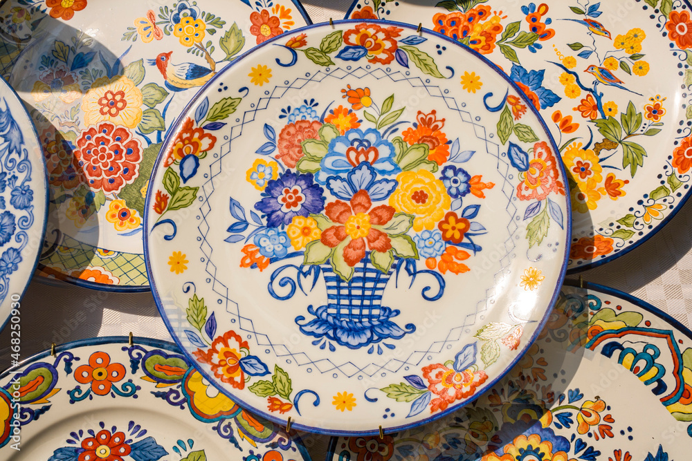 Hand-painted plates with summer flowers.