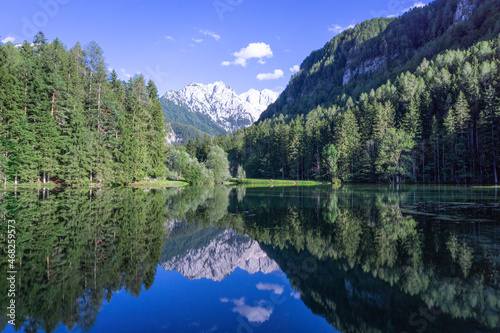 Fototapeta Naklejka Na Ścianę i Meble -  Lake with Slovenian Alps in background and the reflection of mountains in the water