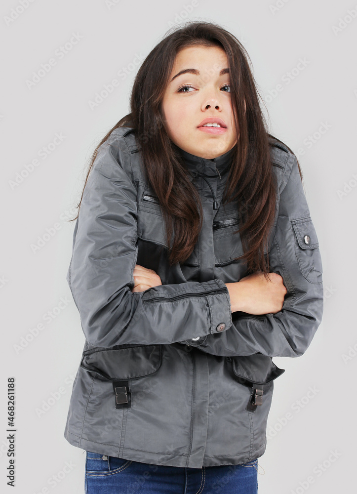 portrait of a girl in a gray waterproof raincoat portrait of a girl in a gray waterproof raincoat