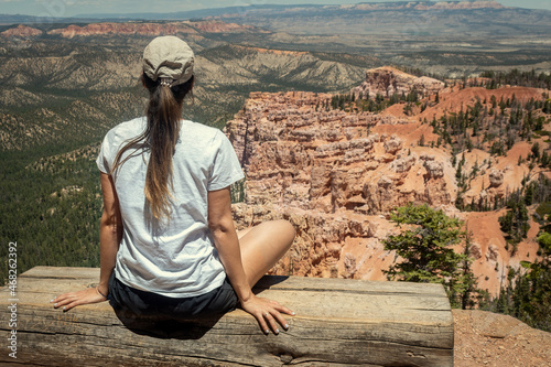 Girl meditating while looking and contemplating a beautiful landscape in a National Park in Utah © Isaac