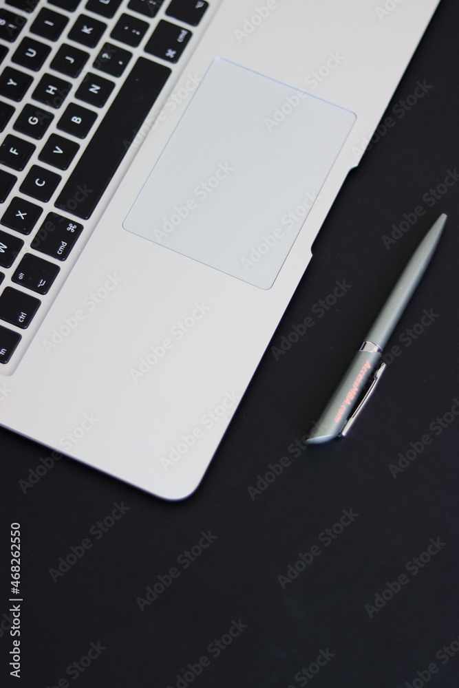 person typing on the keyboard. girl typing on the computer.office. notepad and computer. office worker. laptop on table person typing on the keyboard. girl typing on the computer.office. notepad and computer. office worker. laptop on table