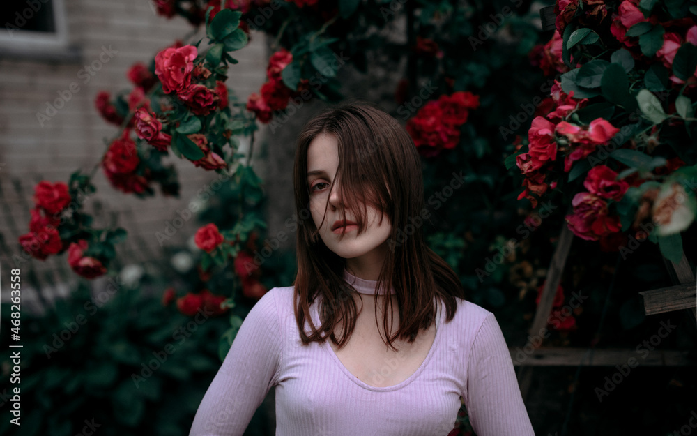 Portrait of a girl in roses