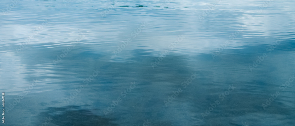 soft backgrounds of reflections of clouds in the water surface