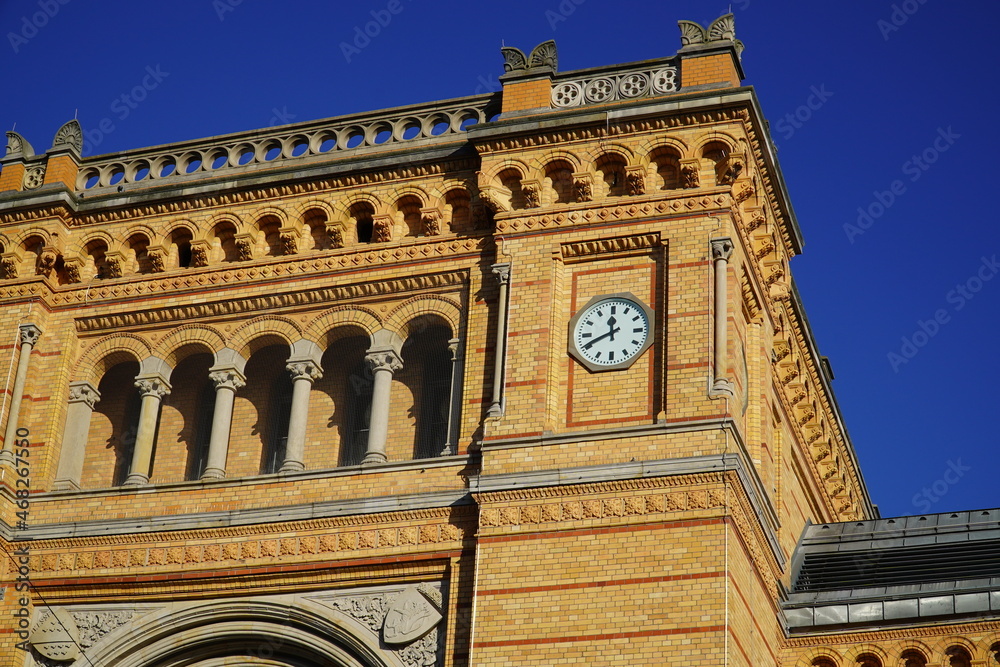 The station clock and the facade on the south side of the central station of Hanover, Lower Saxony, Germany