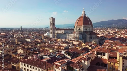 Aerial view. Historically and Culturally Rich Italian Town on the Sunny Day. Beautiful Old City With Medieval Churches and Cathedrals. Clouds in the background photo