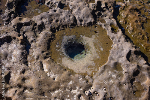 stone ground near the pacific ocean with water