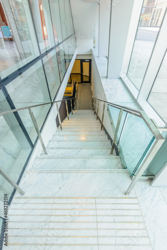 White staircase. Abstract fragment of the architecture of modern lobby, hallway of the luxury hotel, shopping mall, business center in Vancouver, Canada. Interior design.