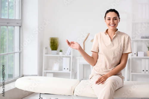 Female massage therapist at...