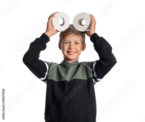 Little boy with rolls of to...