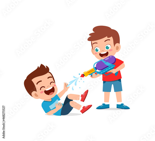 cute little kid holding water gun and play with friend