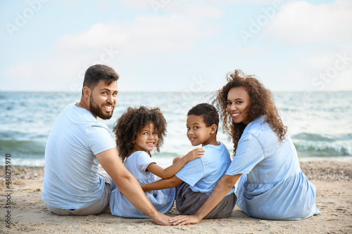 Happy family on sea beach