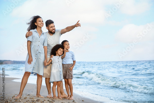 Happy family on sea beach