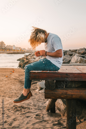 person sitting on the beach