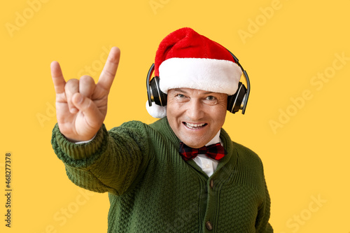 Cool mature man listening t...