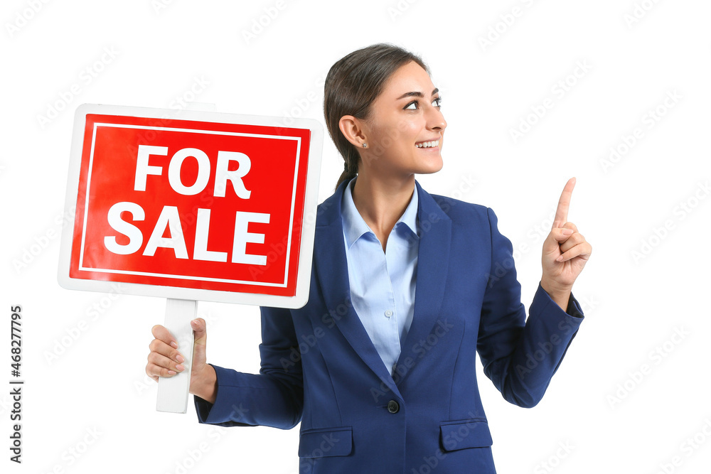 Female real estate agent with sale board showing something on white background Female real estate agent with sale board showing something on white background