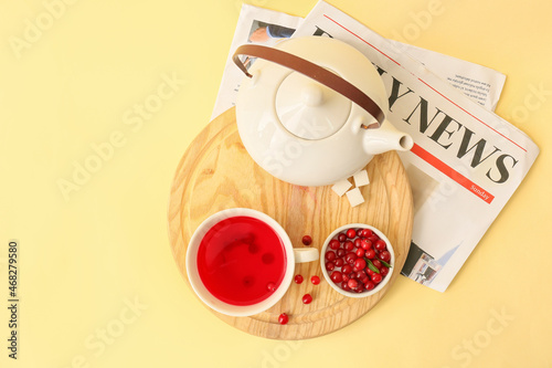 Wooden board with cup of ta...
