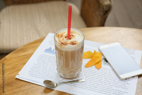 Glass of tasty coffee on ta...