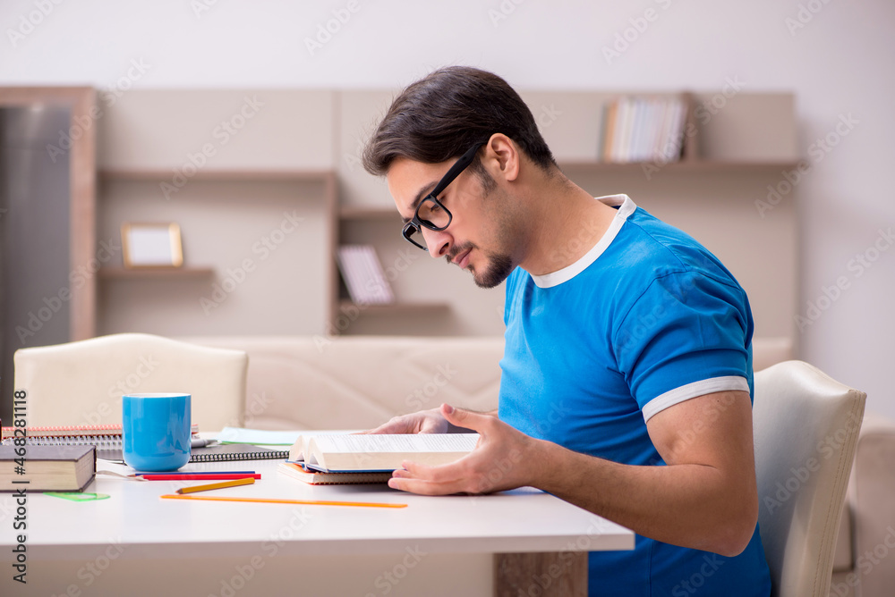 Young male student studying at home Young male student studying at home