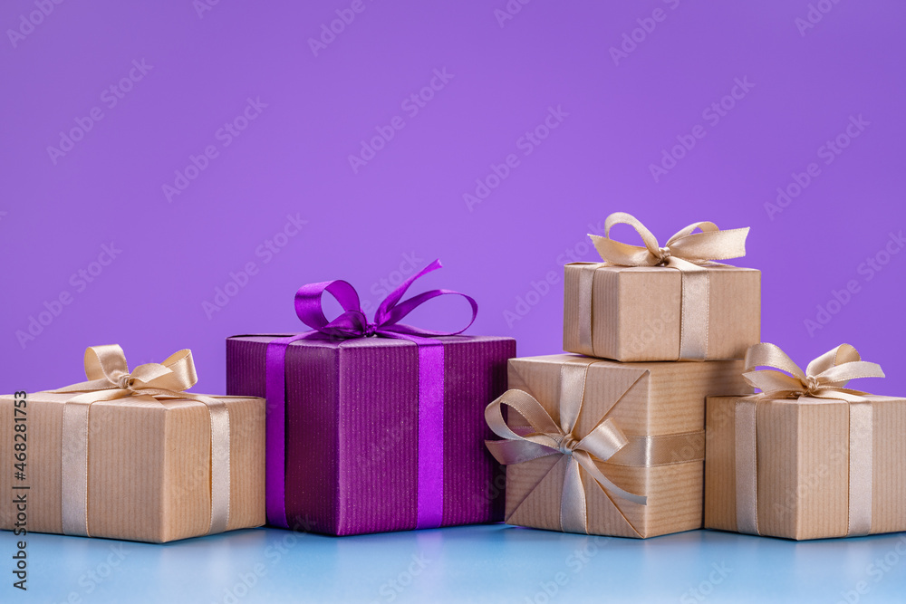 Obraz premium Concept for Christmas, New Year cards, congratulations. Gifts in holiday boxes with ribbons and bows.