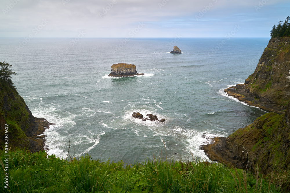Pillar Rock and Pyramid Rock off Cape Meares. The view of Pillar Rock and Pyramid Rock from Cape Meares National Wildlife Refuge on the Oregon Coast, United States.


