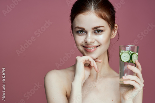 pretty woman with cucumber drink vitamins health beauty