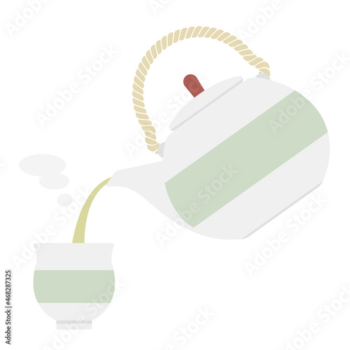 Japanese teapot Kyusu and japanese tea cup Yunomi. Pouring Japanese tea into a teacup.