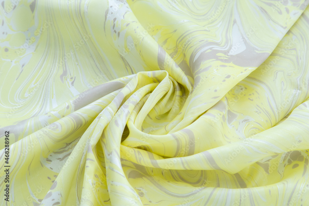Yellow top view of base color silk, fabric with Yellow marble pattern silk, wavy, spiral, crease, swirl, backdrop, cloth background, have copy space for text