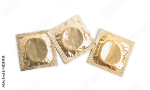 Condom packages on white background, top view. Safe sex