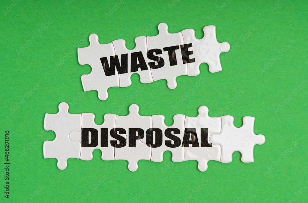 On a green background, there are puzzles on which it is written - waste disposal On a green background, there are puzzles on which it is written - waste disposal