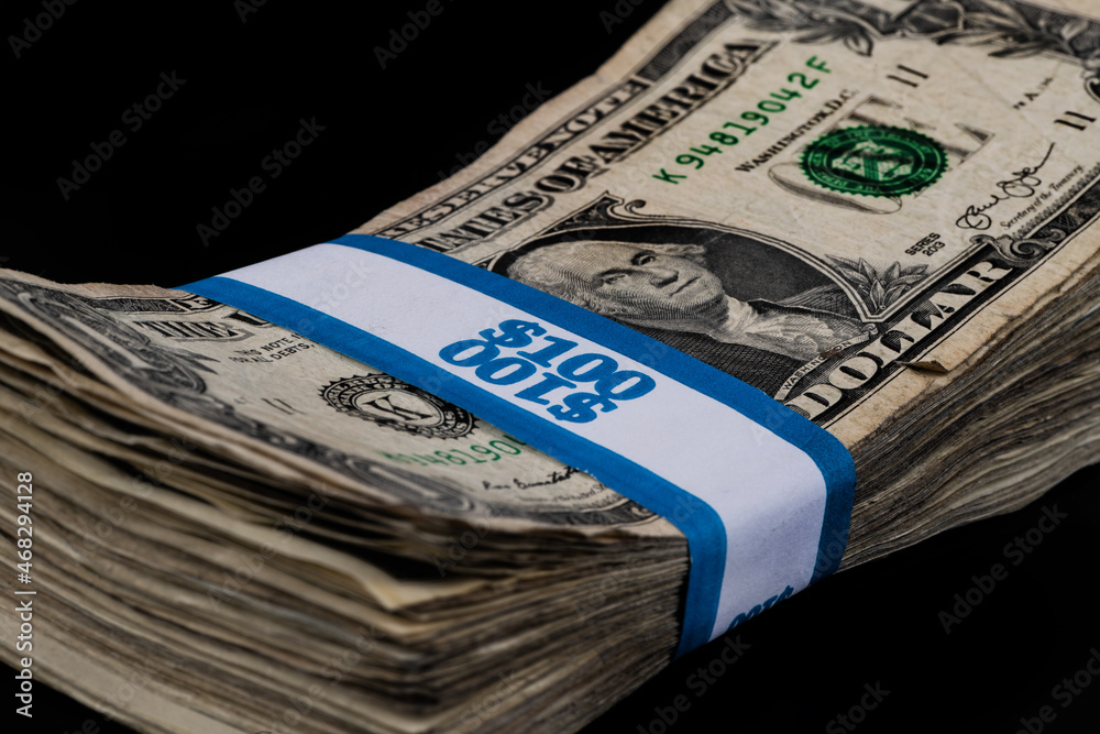 Bundle of tattered 1 American dollar bills Bundle of tattered 1 American dollar bills